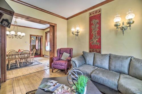 a living room with a couch and a table at Historic Apartment - Half Mi to Lake Champlain! in Plattsburgh