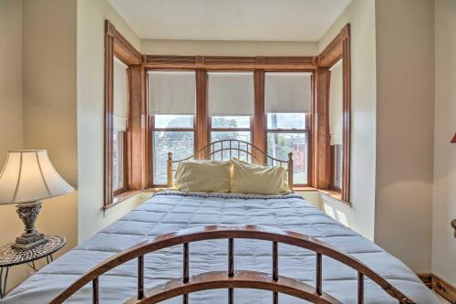 a bedroom with a bed and a window at Historic Apartment - Half Mi to Lake Champlain! in Plattsburgh