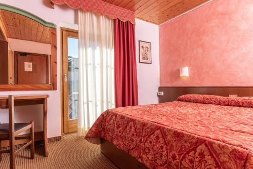 Postel nebo postele na pokoji v ubytování Hotel Italo