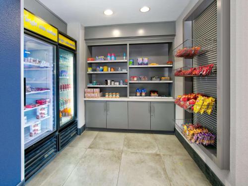a grocery store aisle with a lot of food at La Quinta by Wyndham Dallas - Las Colinas in Irving