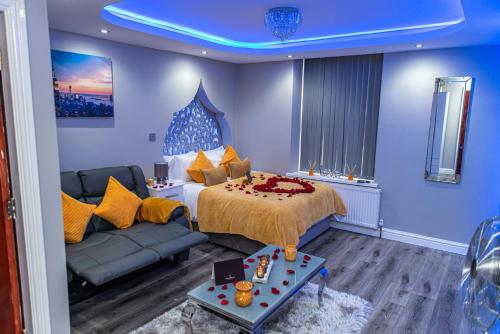 a hotel room with a bed and a couch at Meridian Serviced Apartments in Bradford