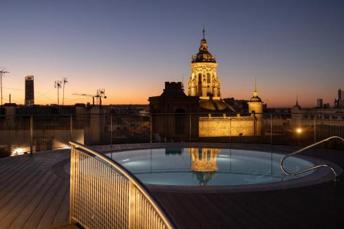 a view of a building with a clock tower at abba Sevilla in Seville