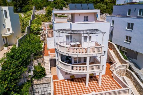 an aerial view of a house with a balcony at Villa Borna Apartments with Free Parking in Dubrovnik