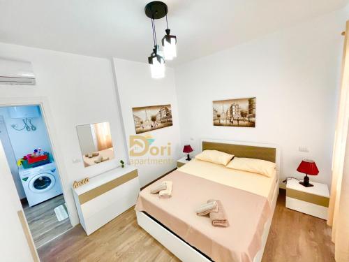 Ένα ή περισσότερα κρεβάτια σε δωμάτιο στο Dori Apartments Perla Resort