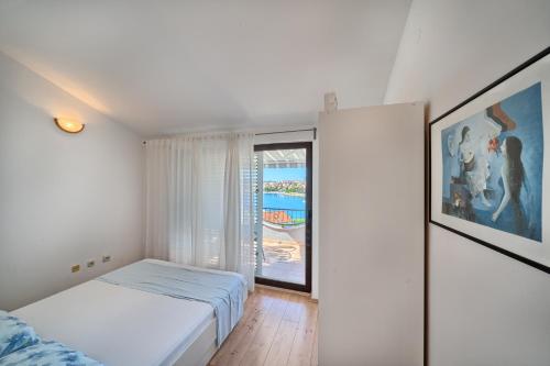 Posteľ alebo postele v izbe v ubytovaní Apartmani Tičić