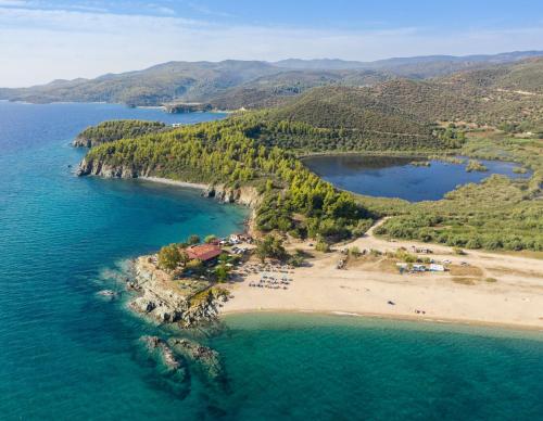 an island in the middle of a body of water at Eco Green Residences & Suites in Toroni