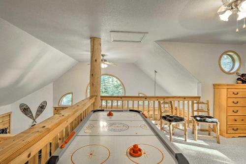 a room with a pool table in the middle of a room at Bayfield Cabin with Wraparound Deck and Fire Pit in Bayfield