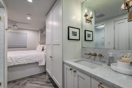 a bathroom with a sink and a bed at Aspen Condo with Mountain Views and Ski Access! in Aspen