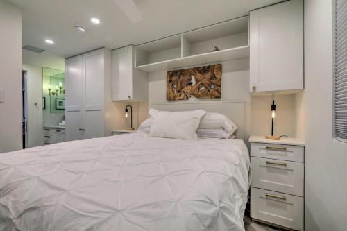 a bedroom with a large bed with white cabinets at Aspen Condo with Mountain Views and Ski Access! in Aspen