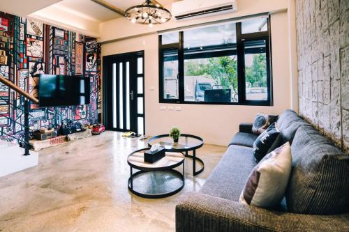 a living room with a couch and a table at 雨禾田 in Sanxing