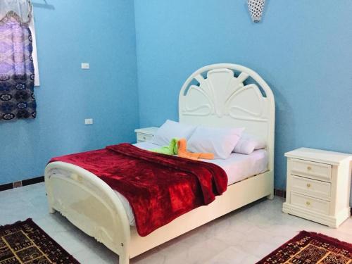 Een bed of bedden in een kamer bij Bob Marley Guest House