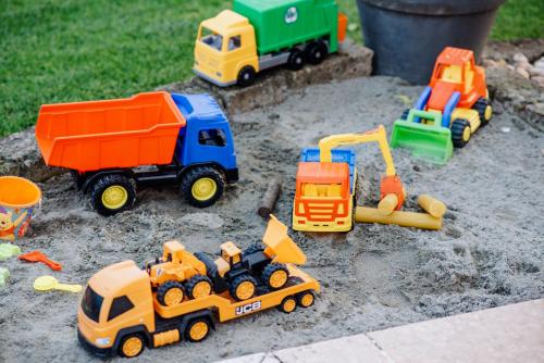a group of toy construction toys in the dirt at La Dolce Vita in Montecchia di Crosara