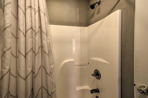 a shower with a white shower curtain in a bathroom at Lake Keowee Escape with Dock, Deck and Lake Access! in Six Mile