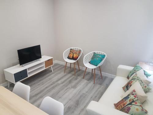 a living room with a couch and two chairs at Bilbao Cozy Apartment with free Wifi in Bilbao