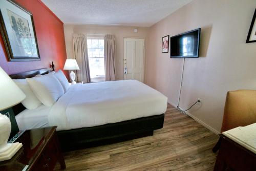 a hotel room with a bed and a television at Parry Lodge in Kanab