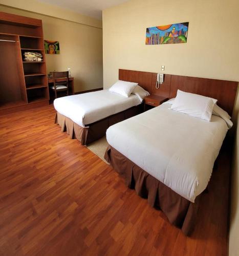 Katil atau katil-katil dalam bilik di Hotel Madrid