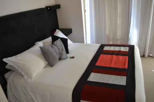 Una cama o camas en una habitación de My Aparts SCL
