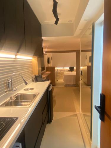 a kitchen with a sink and a counter top at VITORIA MARINA Flat CORREDOR DA VITORIA in Salvador