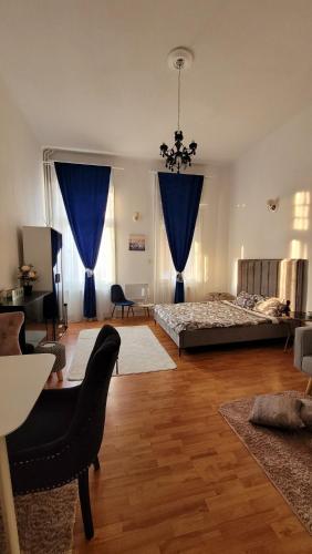 En eller flere senger på et rom på Opera Victoriei Residence - Ultracentral Cozy accommodation