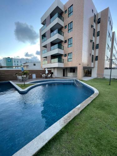 The swimming pool at or close to Flat Beira Mar - Piedade