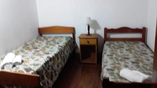 Ένα ή περισσότερα κρεβάτια σε δωμάτιο στο Hotel El Pibe