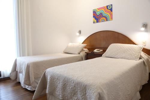 Katil atau katil-katil dalam bilik di Hotel Italiano