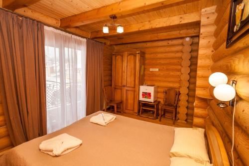Postel nebo postele na pokoji v ubytování Guest house М
