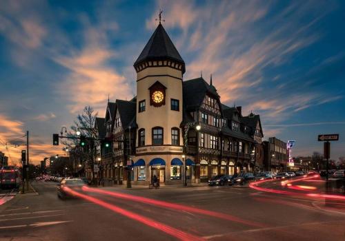a building with a clock tower on a city street at A Stylish Stay w/ a Queen Bed, Heated Floors.. #22 in Brookline
