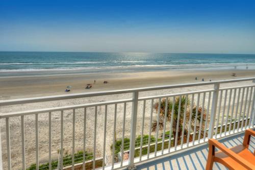 a view of the beach from a balcony at Best Western Aku Tiki Inn in Daytona Beach