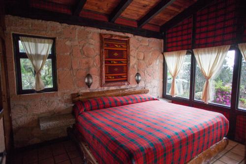 Cama ou camas em um quarto em Monteverde