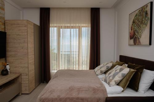 Letto o letti in una camera di Ski & Spa Apartment N34 Milmari Resort Kopaonik