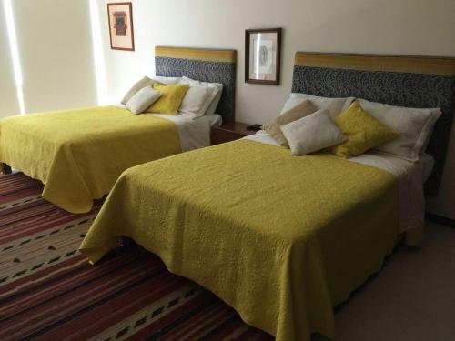 Кровать или кровати в номере Ocean front apartment in Cancun