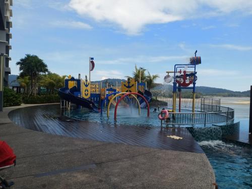 a water park with a water slide in the water at Imperium Residence Tanjung Lumpur SEAVIEW Studio Hafiz in Kuantan