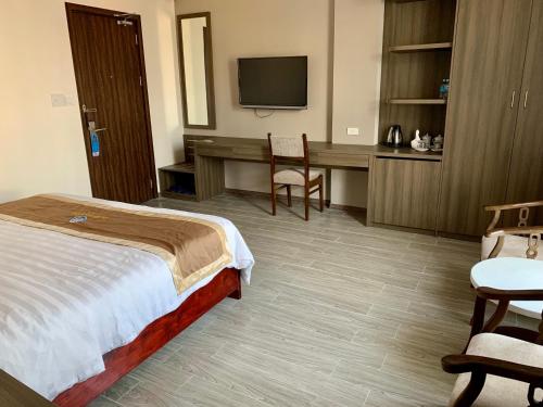 Postel nebo postele na pokoji v ubytování Da Huong Hotel