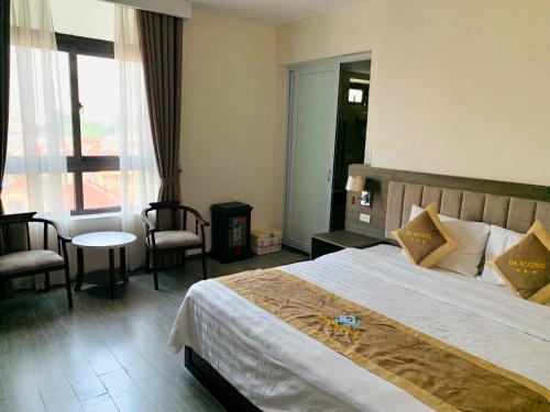 Postel nebo postele na pokoji v ubytování Da Huong Hotel