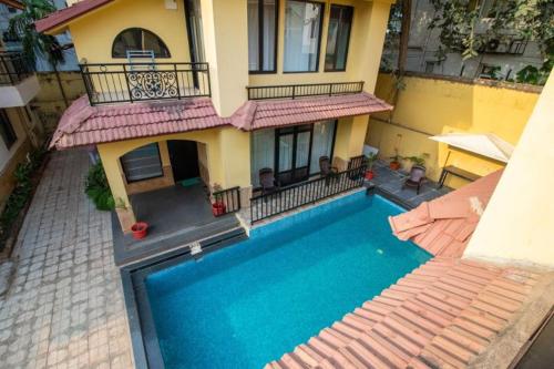 an aerial view of a house with a swimming pool at VILLA M - LAGOON 4 Calangute 3BHK Pool Facing, Breakfast Included in Old Goa