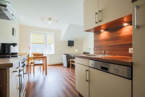 a kitchen with a sink and a counter top at Buedlfarm-SuedOst in Sahrensdorf