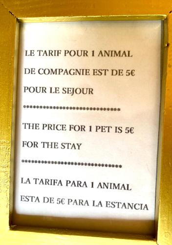a sign in a gold frame with writing on it at Escale sous le Chêne in Salles