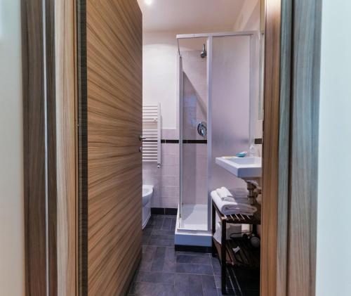 a bathroom with a shower and a sink and a toilet at Casa Mia in Trastevere in Rome