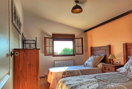 Llit o llits en una habitació de El Guardaviñas, entre Montes y Viñedos