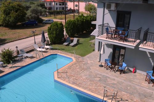 an overhead view of a swimming pool next to a building at Aliston Hotel Thassos in Skala Potamias