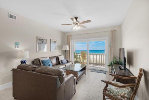 a living room with a couch and a table at Villas on the Gulf unit M5 in Pensacola Beach