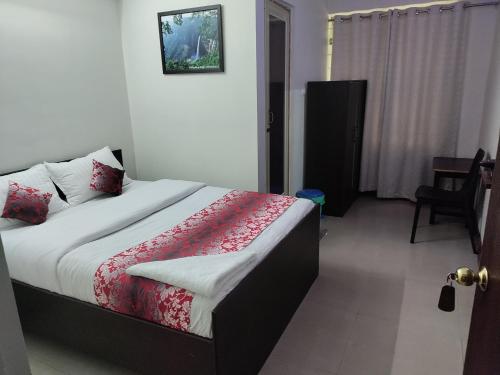 a bedroom with a bed in a room at White Rabbit Guest House in Shillong