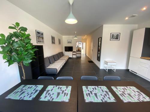 a living room with a couch and a table at Isabel Apartments in Antwerp