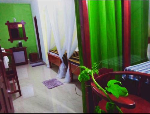 Katil atau katil-katil dalam bilik di Elegant Home Stay