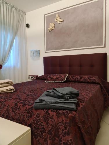 Postel nebo postele na pokoji v ubytování Memories B&B