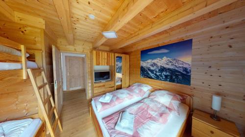 A bed or beds in a room at Almhütte Lachtal