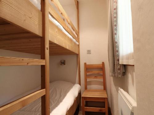 a bedroom with two bunk beds with a ladder at Studio Méribel, 1 pièce, 4 personnes - FR-1-182-197 in Les Allues