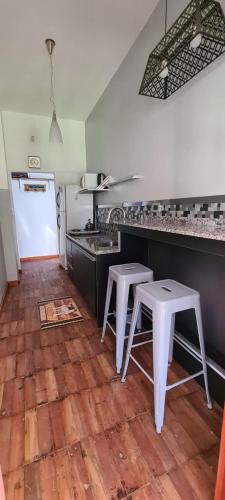 Η κουζίνα ή μικρή κουζίνα στο Apart y Suite Portal del Luz