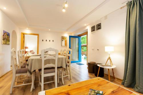 a dining room with a table and chairs at Garmen Hills Guest Houses in Garmen